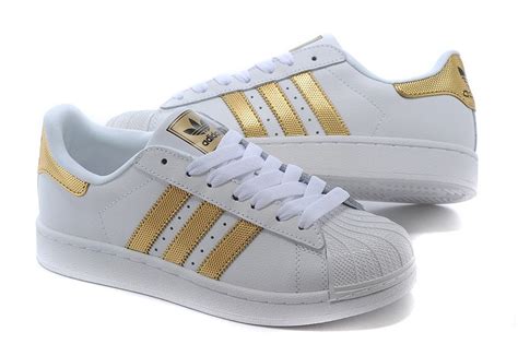weiße adidas schuhe mit goldenen streifen